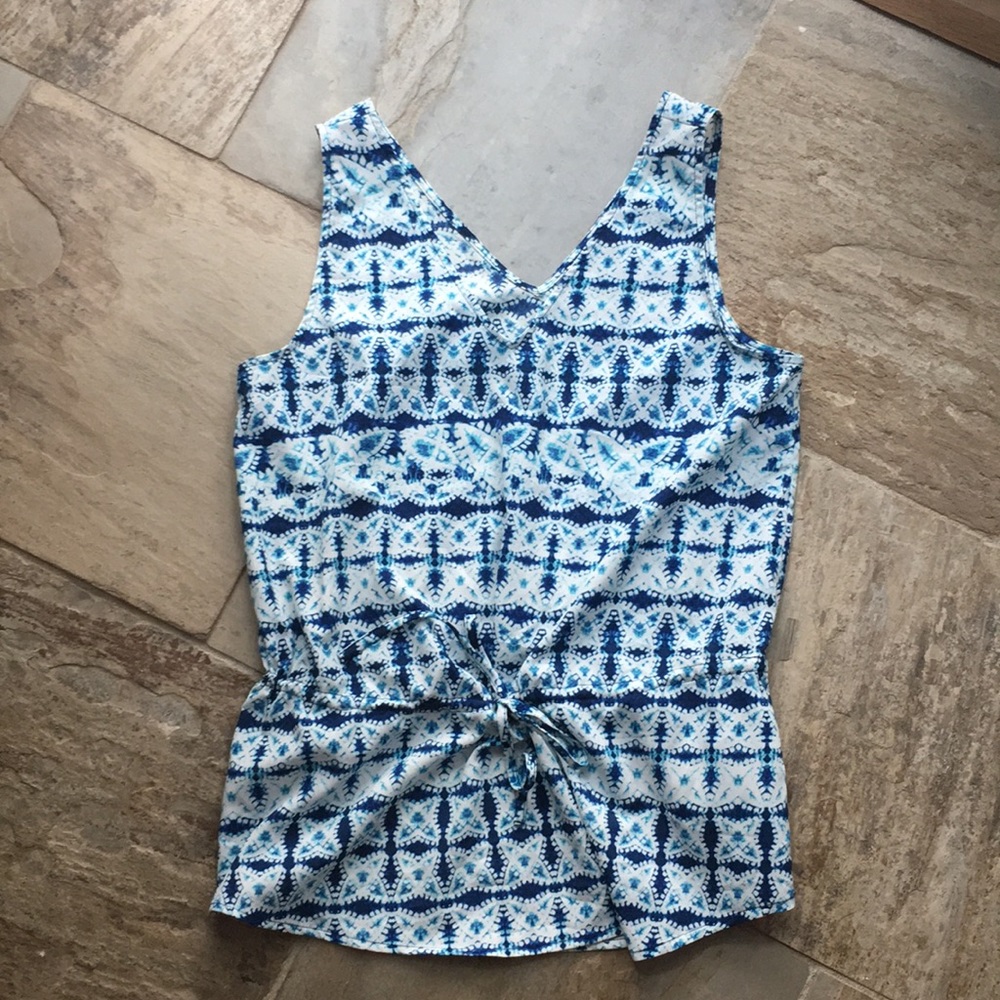 Blue and white patterned sleeveless blouse